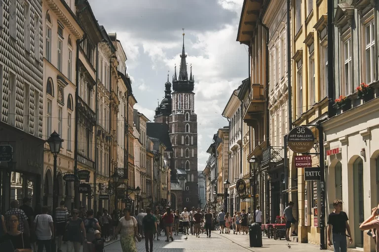 Packed suitcase by an apartment window in Krakow, early morning light