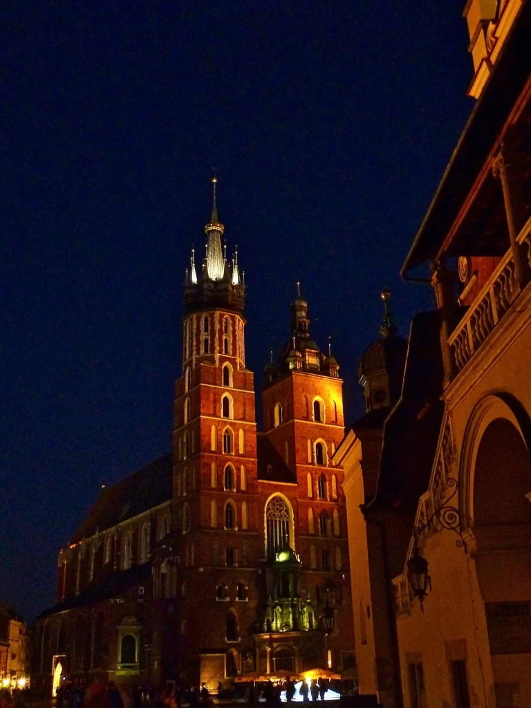 Main Square at night, warm streetlights, quiet, once the crowds leave